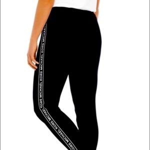 Michael Kors logo on strip leggings